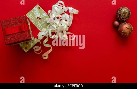 Christmas background with gift boxes and decorations on red.  Stock Photo