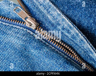 Close up of broken zipper on jeans Stock Photo