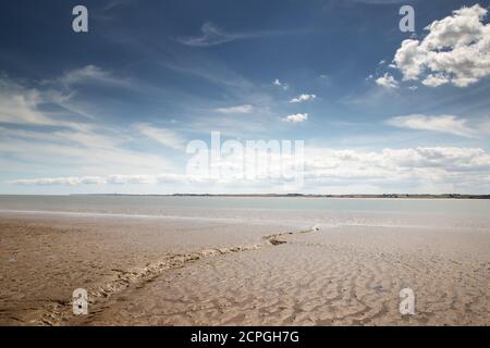 seascape image of a muddy beach looking out at the river thames from canvey island in essex Stock Photo