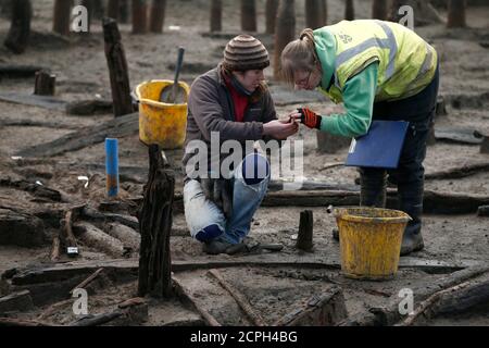 An Archaeologists From The University Of Cambridge Archaeological Unit ...