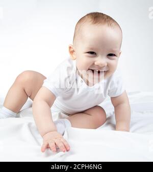 Photo of crawling eleven-month-old baby on a white background Stock Photo