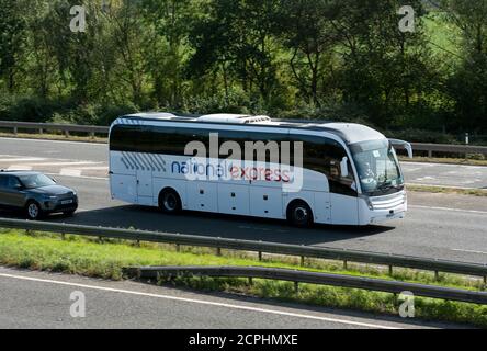 A National Express coach on the M40 motorway, Warwickshire, UK Stock Photo