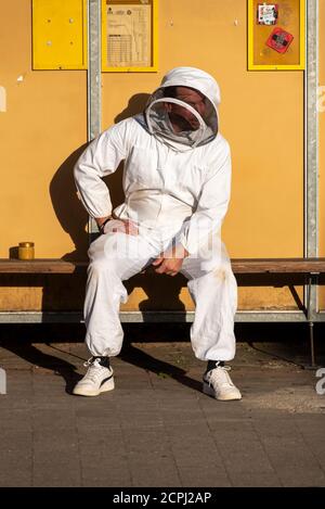 Beekeeper is waiting for the bus Stock Photo