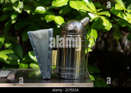 Device for smoking bees, smoke calms bees Stock Photo