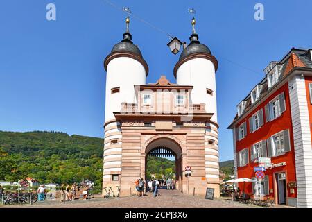 Heidelberg, Germany - September 2020: Gate to old 'Karl Theodor' bridge over the Neckar river in city center on a sunny day Stock Photo