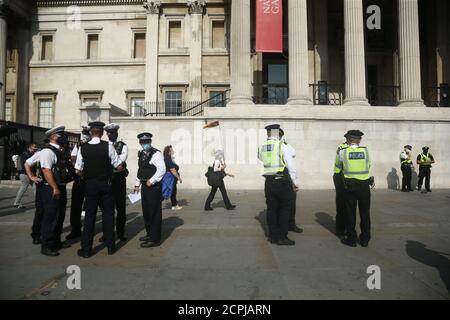Police presence during an anti-vax protest in London's Trafalgar Square. Stock Photo