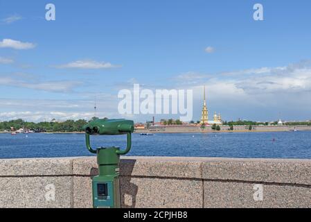 Saint-Petersburg, Russia – July 10, 2020: Binoculars for sightseeing on The Palace Bridge. On the background is The Peter and Paul Fortress Stock Photo
