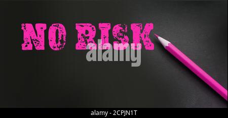 message No risk is written on black with magenta pencil. Business investment concept. Healthcare concept Stock Photo