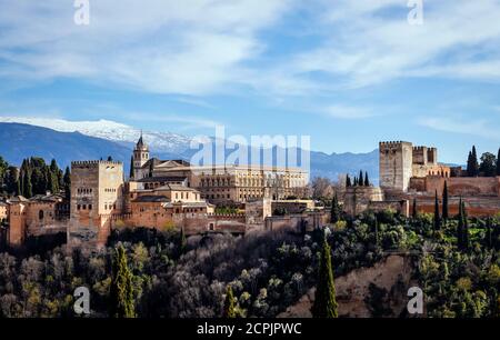 Alhambra Moorish City Castle, Nasrid Palaces, Charles V Palace, snow-covered Sierra Nevada in the back, Granada, Andalusia, Spain Stock Photo