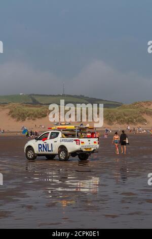 RNLI on patrol on the beach at Croyde, North Devon in high summer Stock Photo
