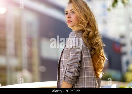 Portrait of attractive young woman in the city Stock Photo