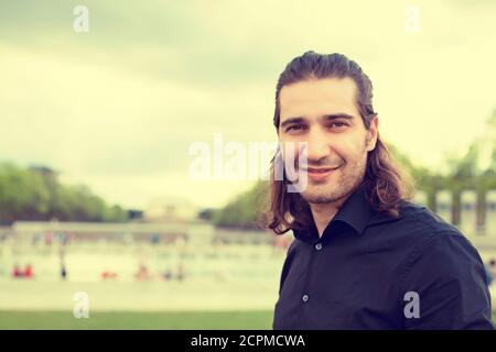 Headshot portrait of young man smiling isolated on outside outdoors Washington DC Lincoln Memorial background Stock Photo