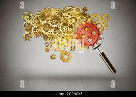 Security idea generation focus concept. Magnifying glass verifying a group of server gears representing internet protection from cyber crimes or teamw Stock Photo