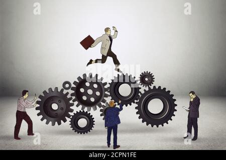 Conceptual image of businessteam working cohesively on gray office wall background. Interaction and unity Stock Photo