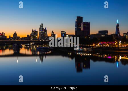 England, London, River Thames and City Skyline at Night Stock Photo
