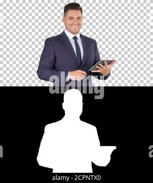 Expressive young businessman with tablet presenting something sw Stock Photo