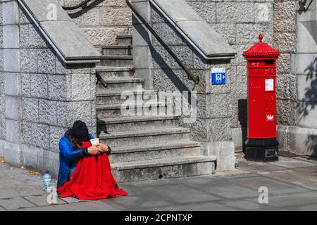 England, London, Southwark, Beggar and Empty Stairs at Tower Bridge Stock Photo