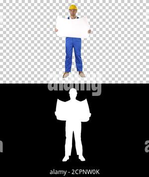 Construction worker checking blueprints on site, Alpha Channel Stock Photo