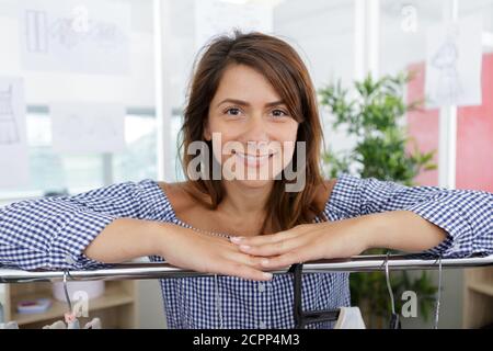 woman leaning on rail clothes Stock Photo