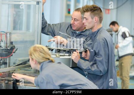 factory manager and engineering apprentice Stock Photo