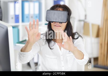 woman using laptop via virtual reality glasses Stock Photo