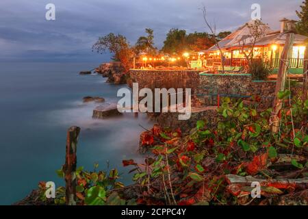 Twilight at 3 Dives point in Negril, Jamaica. The rocky outcrops are very popular for cliff jumping and the location is renown for watching the sunset Stock Photo