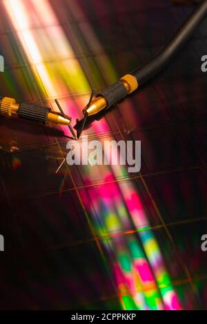 Manual probe system with needles for test of semiconductor on silicon wafer. Selective focus. Stock Photo