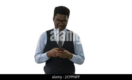 Happy young african american business man walking and texting on Stock Photo
