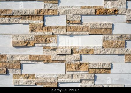 Stone wall brick texture background beige and white surface facade. Close - up. Hight quality photo Stock Photo