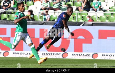 Bremen, Germany. 19th Sep, 2020. Football: Bundesliga, Werder Bremen - Hertha BSC, 1st matchday. Werder's Theodor Gebre Selassie (l) could not prevent Dodi Luebakio's shot for the 0:2. Credit: Carmen Jaspersen/dpa - IMPORTANT NOTE: In accordance with the regulations of the DFL Deutsche Fußball Liga and the DFB Deutscher Fußball-Bund, it is prohibited to exploit or have exploited in the stadium and/or from the game taken photographs in the form of sequence images and/or video-like photo series./dpa/Alamy Live News Stock Photo