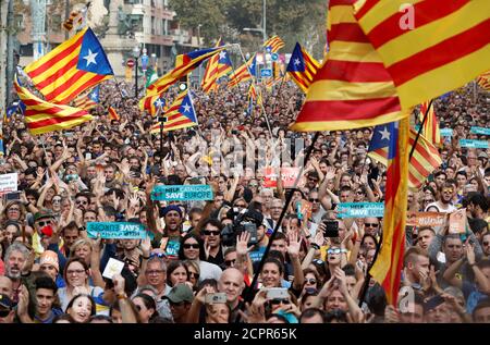People react while the Catalan regional parliament votes for independence of Catalonia from Spain in Barcelona, Spain October 27, 2017. REUTERS/Yves Herman