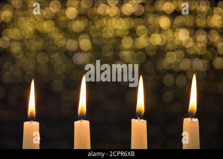 Four burning candles on the fourth advent Stock Photo