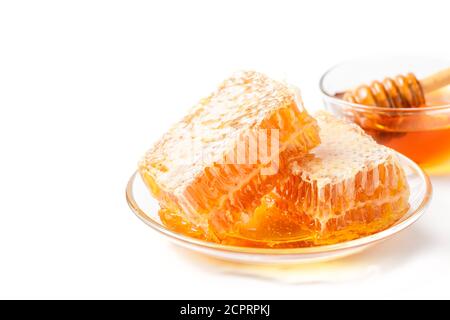 Fresh honey and honeycomb isolated on white background with copy space, bee products by organic natural ingredients concept Stock Photo