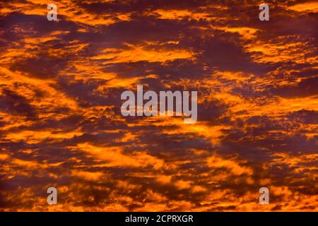 Fiery beautiful clouds at sunrise Stock Photo