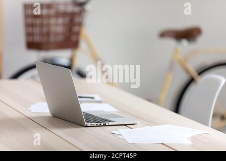 Empty office worker workplace, modern wooden table with laptop Stock Photo