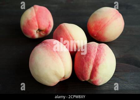 Heap of Fresh Ripe Peaches on Black Background Stock Photo