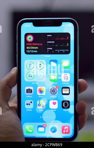 iPhone 11 with new home screen widgets of iOS14. The latest version of iOS is released on September 16, 2020 & appreciated for new features Stock Photo