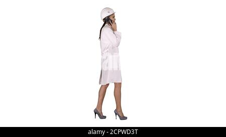 Female science engineer making a call while walking on white bac Stock Photo