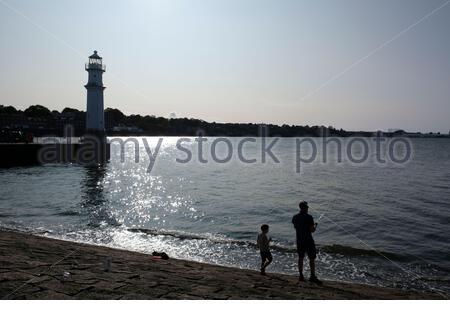 Edinburgh, Scotland, UK. 19th Sep 2020. Fisherman on a warm and Sunny late afternoon at Newhaven harbour in the Firth of Forth Estuary.  Credit: Craig Brown/Alamy Live News Stock Photo