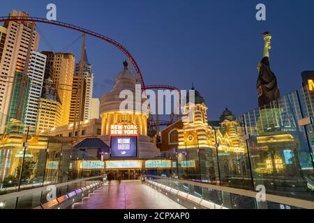 Las Vegas, SEP 15, 2020 - Night view of the Statue of Liberty wear Raiders football shirt and face mask with The New York New York casino Stock Photo