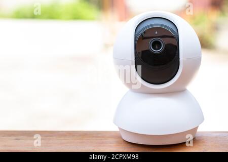 A blank white CCTV camera security that hasn't been installed on the table. Stock Photo