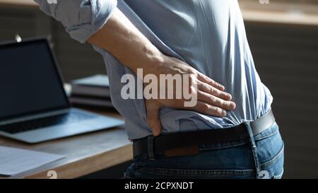 Close up of unhealthy man struggle with back pain Stock Photo