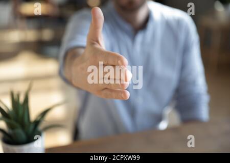 Close up of male worker stretch hand greeting Stock Photo