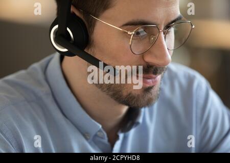 Close up of Caucasian man in headset talk online Stock Photo