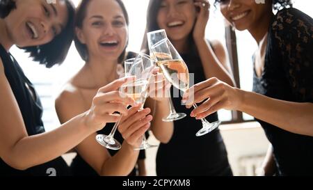 Close up focus on glasses with champagne joined together. Stock Photo