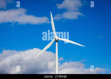 Wind turbine against a blue sky with clouds, Ense, North Rhine-Westphalia, Germany Stock Photo