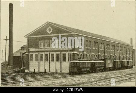 . The street railway review . umns one foot square. In this pit are five hydraulic hoistssimilar to those previously described in connection with the cat-storage room. At the front end of the south track two of thesehoists arc located near together for handling armatures under double-truck cars. The othei afe far enough aj I for simulta-neous use on different 1 u In the front part of the repair shop, located neat tin potthe new baj which is sel off for carpentry work, 1 the lai ;i hoi Iused when it is desired t lift a car body 50 h it il trucl mayhe run out for repairs. The hoist is placed in
