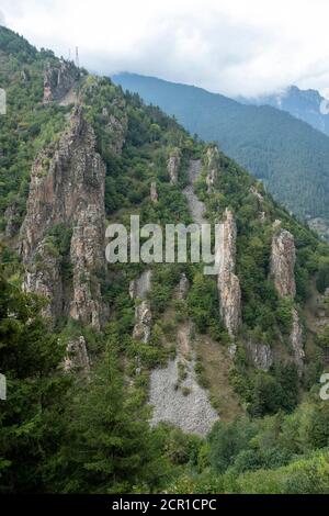 A dike or dyke, in geological usage, is a sheet of rock that is formed in a fracture of a pre-existing rock body. Stock Photo