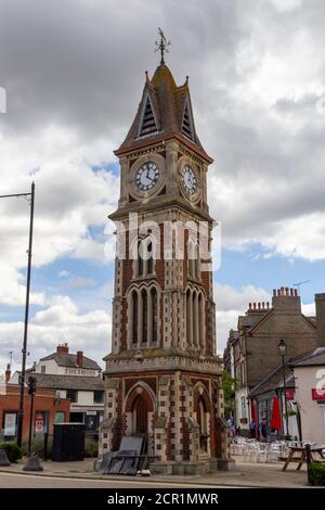 The Clock tower (a Jubilee Clock to commemorate Queen Victoria’s Golden Jubilee in 1887) on the High Street in Newmarket, Suffolk, UK. Stock Photo