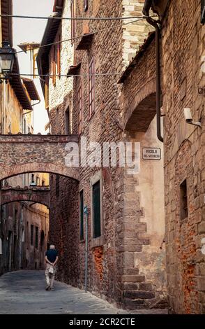 House, alley, man, Pistoia, Tuscany, Italy Stock Photo
